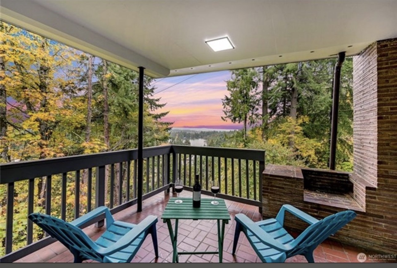 Covered deck with sunset water view